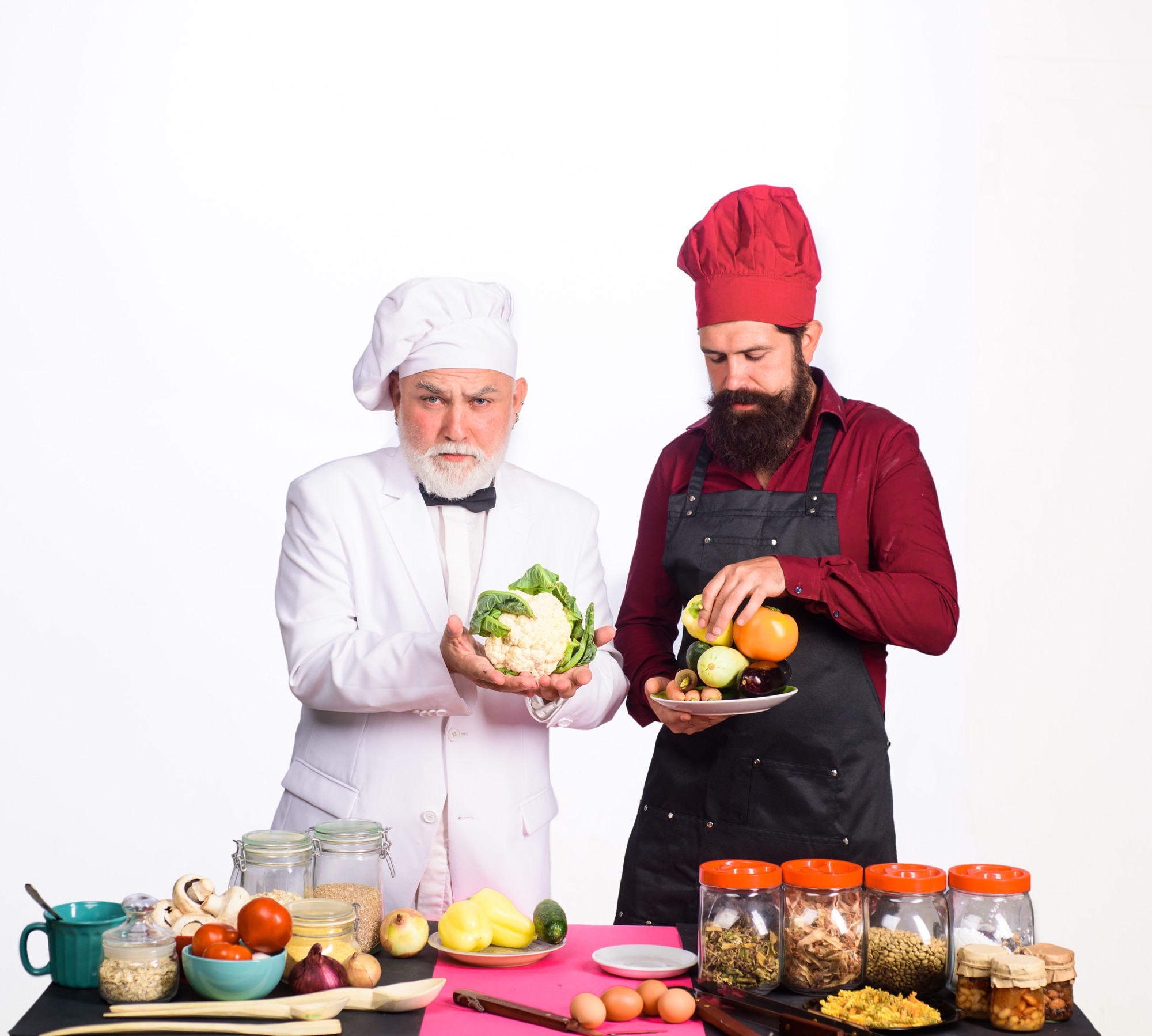 Chef teaching small group in bright kitchen